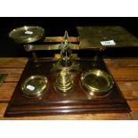 A set of postal scales with brass weights