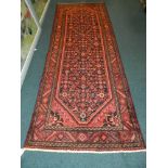 A modern north west Persian design red and blue ground runner
