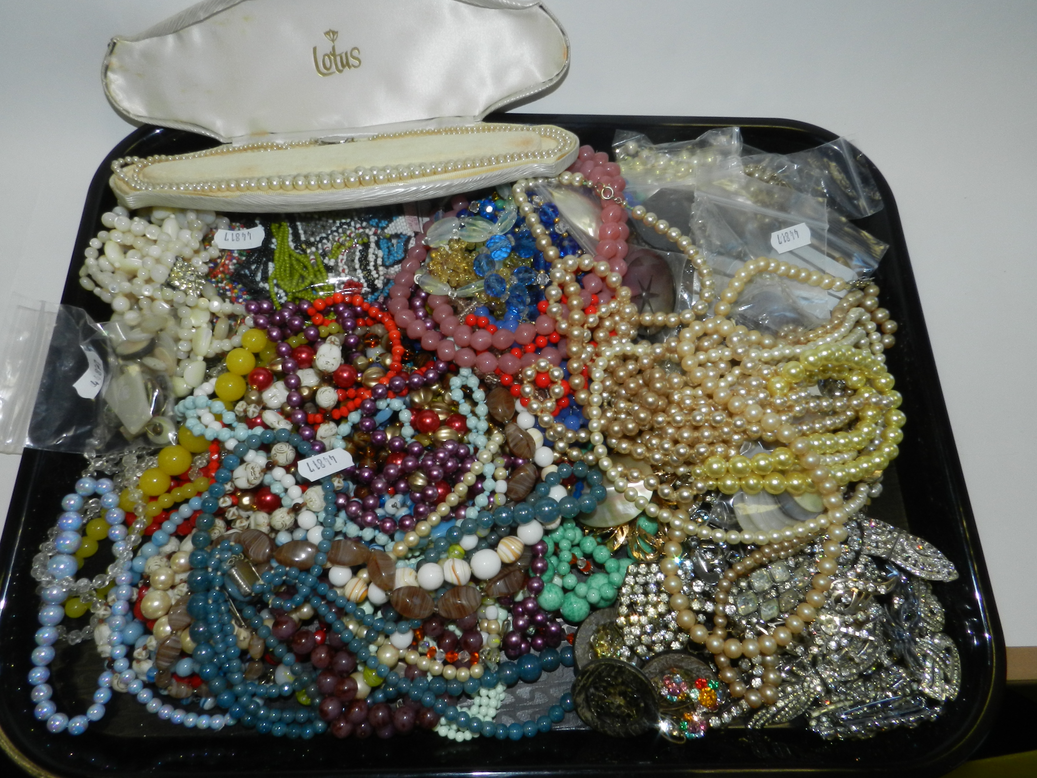 A large collection of pieces of costume jewellery to include a quantity of paste set brooches,