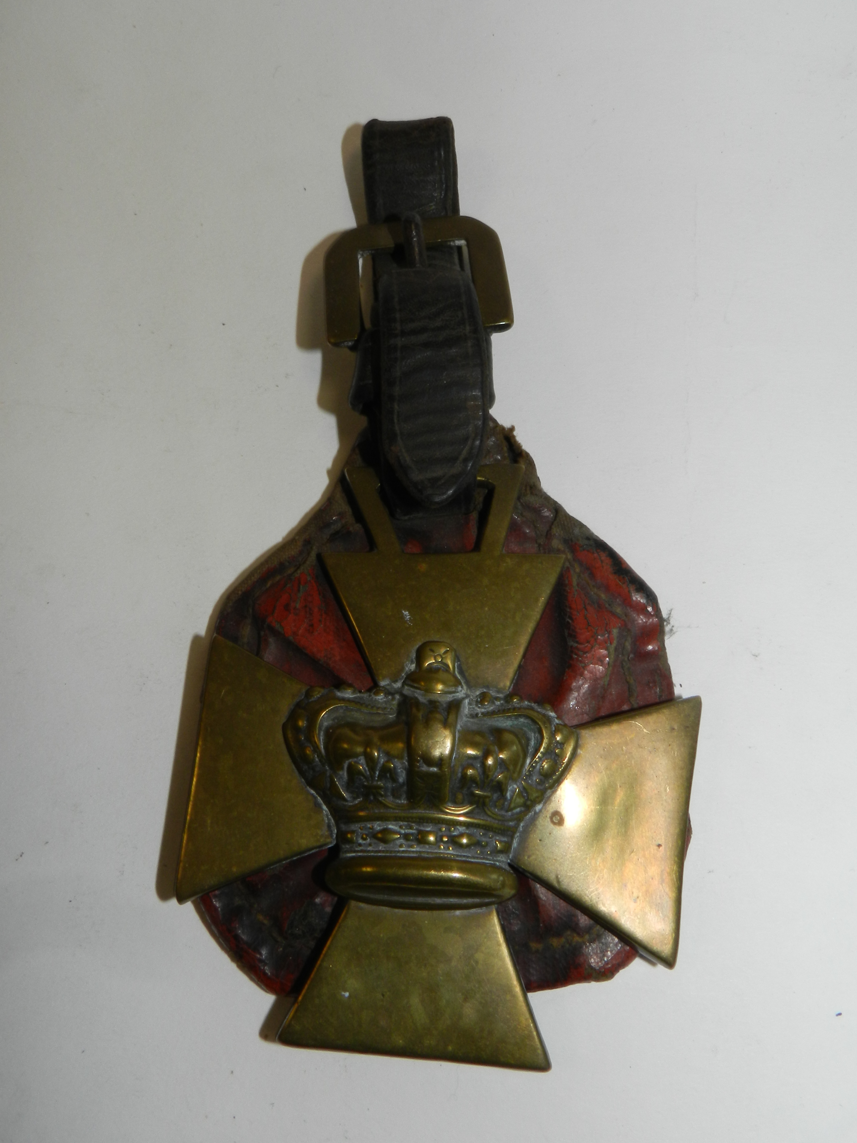 A 19th century Maltese cross horse brass mounted with crown
