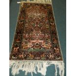 A modern tree of life design red and cream ground rug