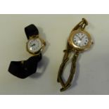 An 18 carat gold wristwatch with cord strap together with a 9 carat gold wristwatch with gilt metal