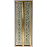 A pair of Chinese embroidered panels, 20th century, each depicting a mirrored design of flowers,