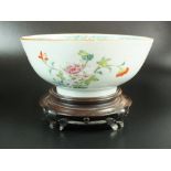 A Chinese export porcelain famille rose bowl with hardwood stand, Qing Dynasty, 18th century,