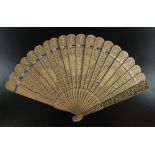 A Chinese Canton export carved sandalwood brise fan, second half 19th century,