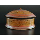 An Indian wood and lacquer spice box and cover, 20th century, of circular form,