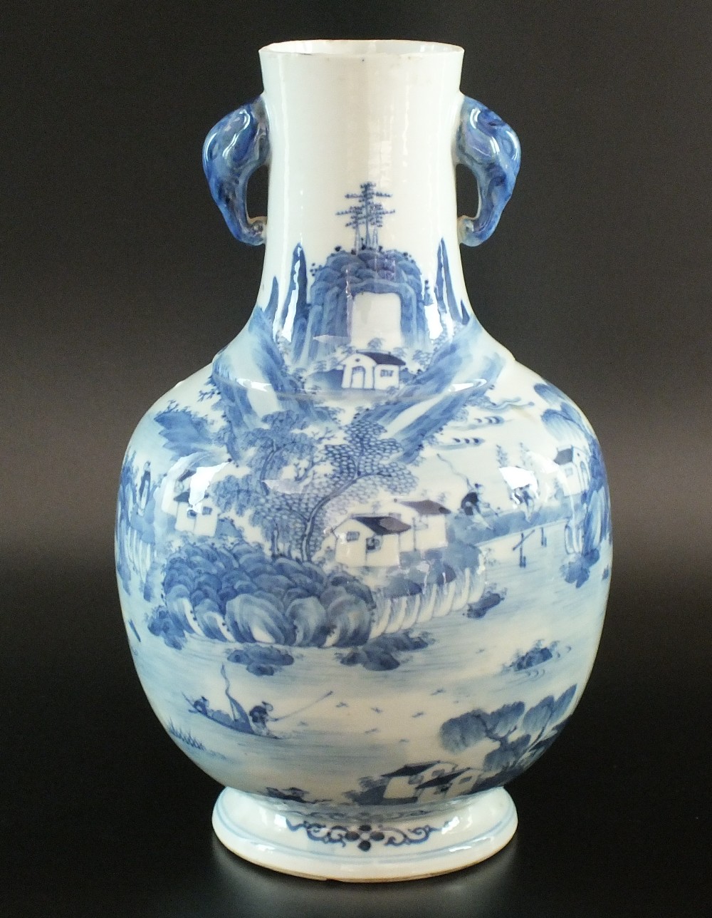 A Chinese blue and white vase, late 19th century, of baluster form with twin elephant head handles,