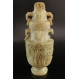 A Chinese soapstone vase and cover, 20th century, raised on a pedestal foot,