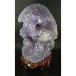 A Chinese carved amethyst crystal model of an eagle and carp, 20th century,