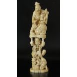 A Japanese carved marine ivory okimono, Meiji Period, late 19th century, carved as two Oni,