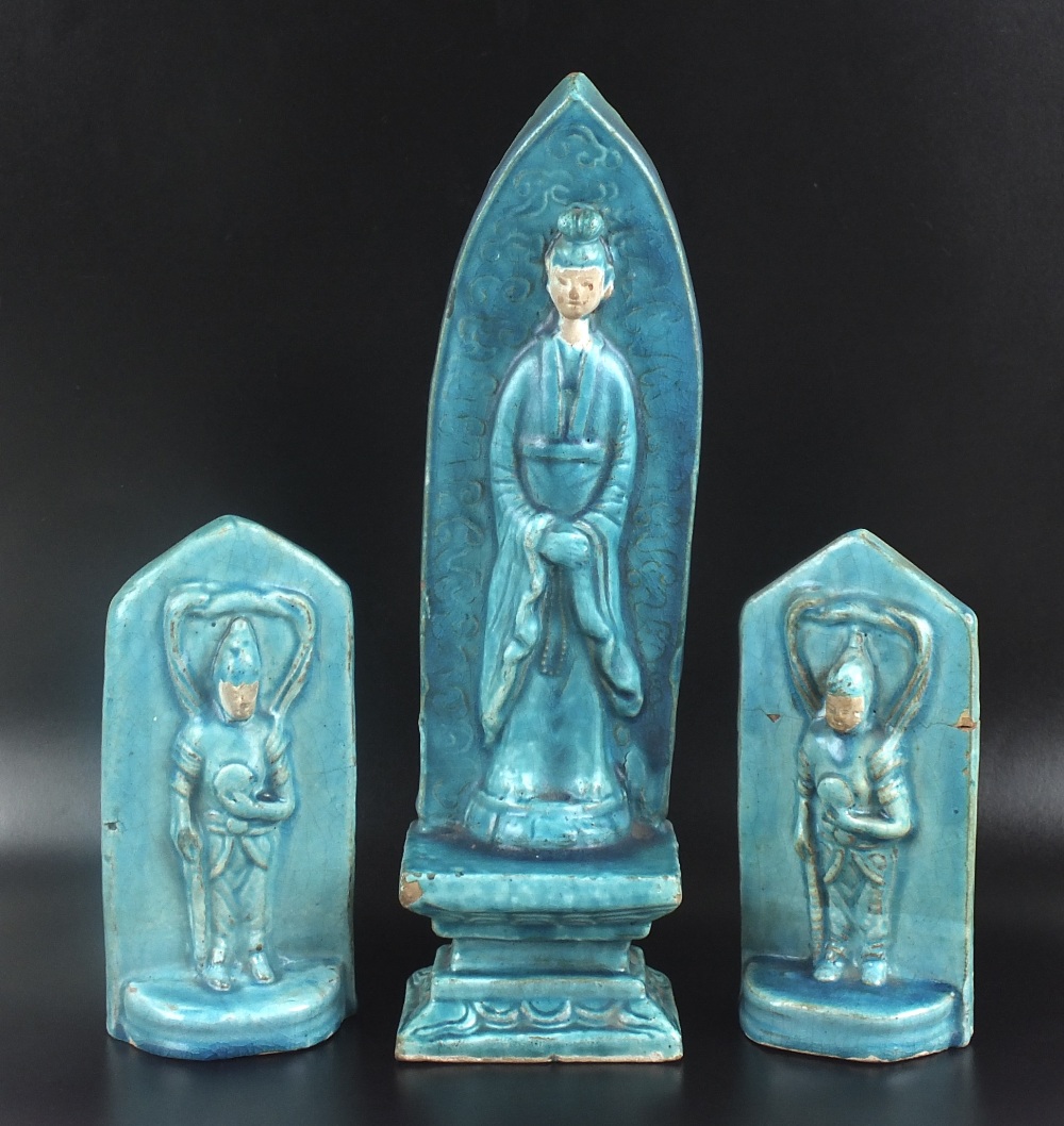 A figural stele in archaic Chinese style, with all over turquoise glaze,