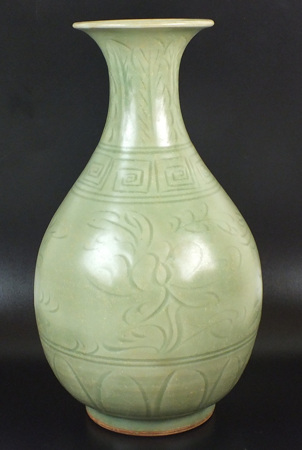 A Chinese dark celadon glaze vase, late 20th century, of pear shape form with flared lip,