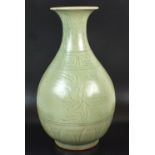 A Chinese dark celadon glaze vase, late 20th century, of pear shape form with flared lip,