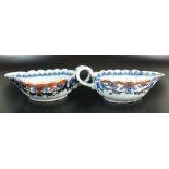 A pair of Chinese export porcelain 'clobbered' sauce boats, Qianlong period,