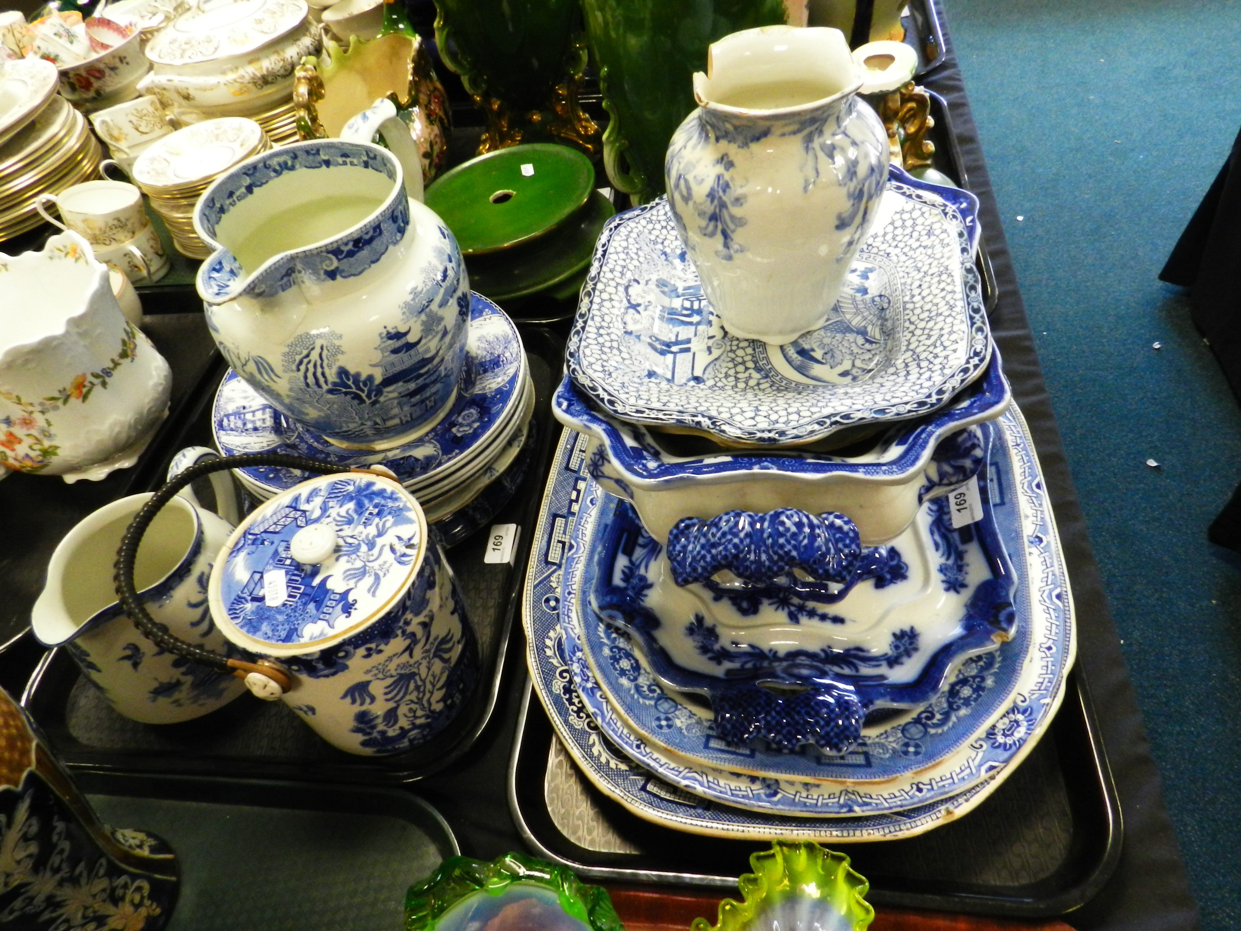 A collection of English blue and white ceramics to include two Willow pattern jug,