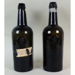 A pair of early 19th century sealed wine bottles, the bases stamped H.
