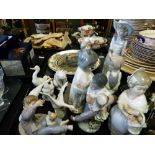 A collection of Nao porcelain figures
