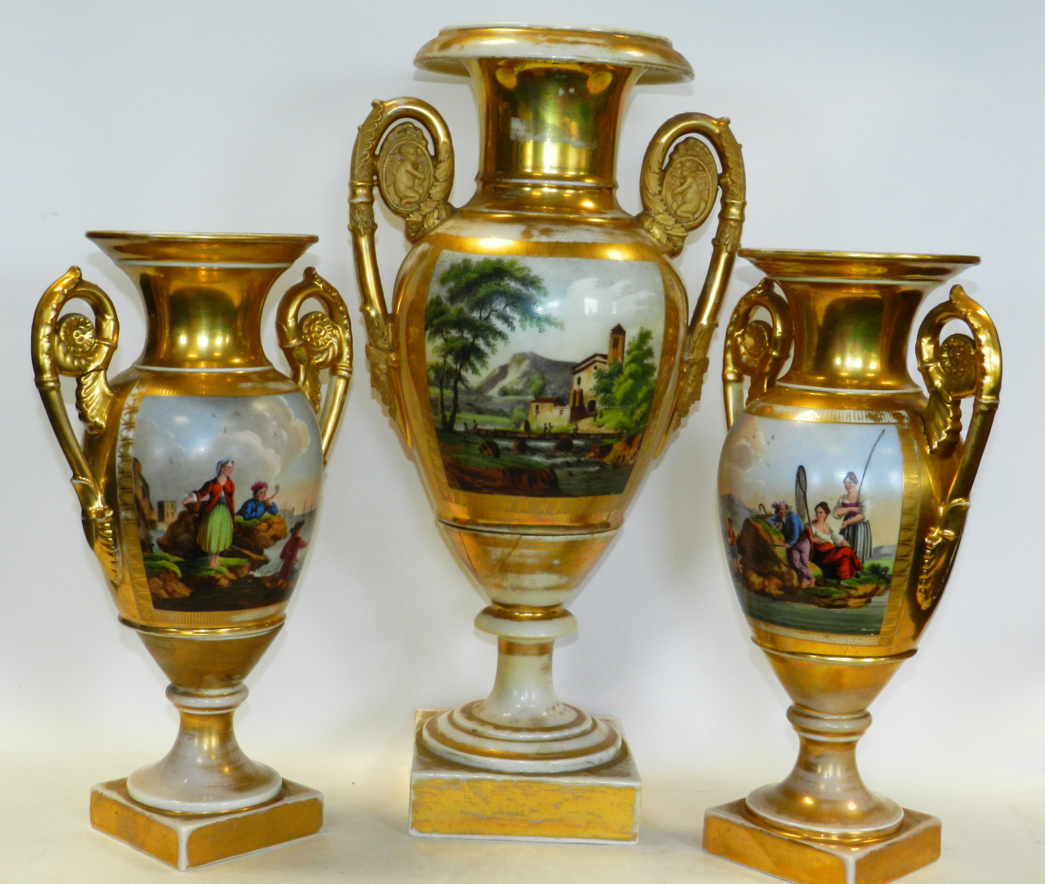 A matched garniture of three Paris Empire style porcelain gilt ground twin handled vases, - Image 2 of 2