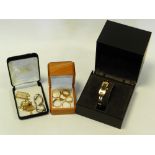 A cased Gucci wristwatch together with a 9 carat gold ingot pendant,