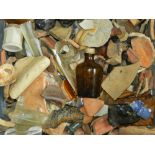 A mixed collection of various shards including pottery and glass