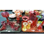 Two trays of cranberry and uranium Victorian glassware to include a table lustre, vases, baskets,