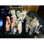 Four trays including various Staffordshire figures and dogs,