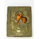 A Russian Madonna and Child icon with brass overlay