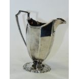 A silver helmet shaped cream jug hallmarked 'Sheffield'.