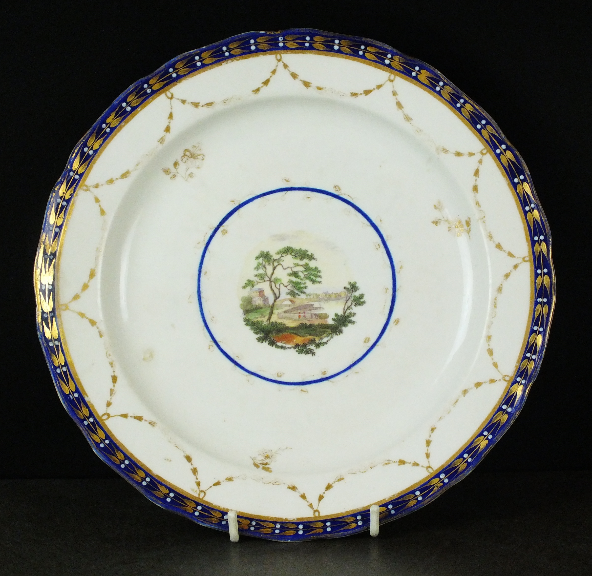 An English porcelain landscape plate, possibly Derby, circa 1790,