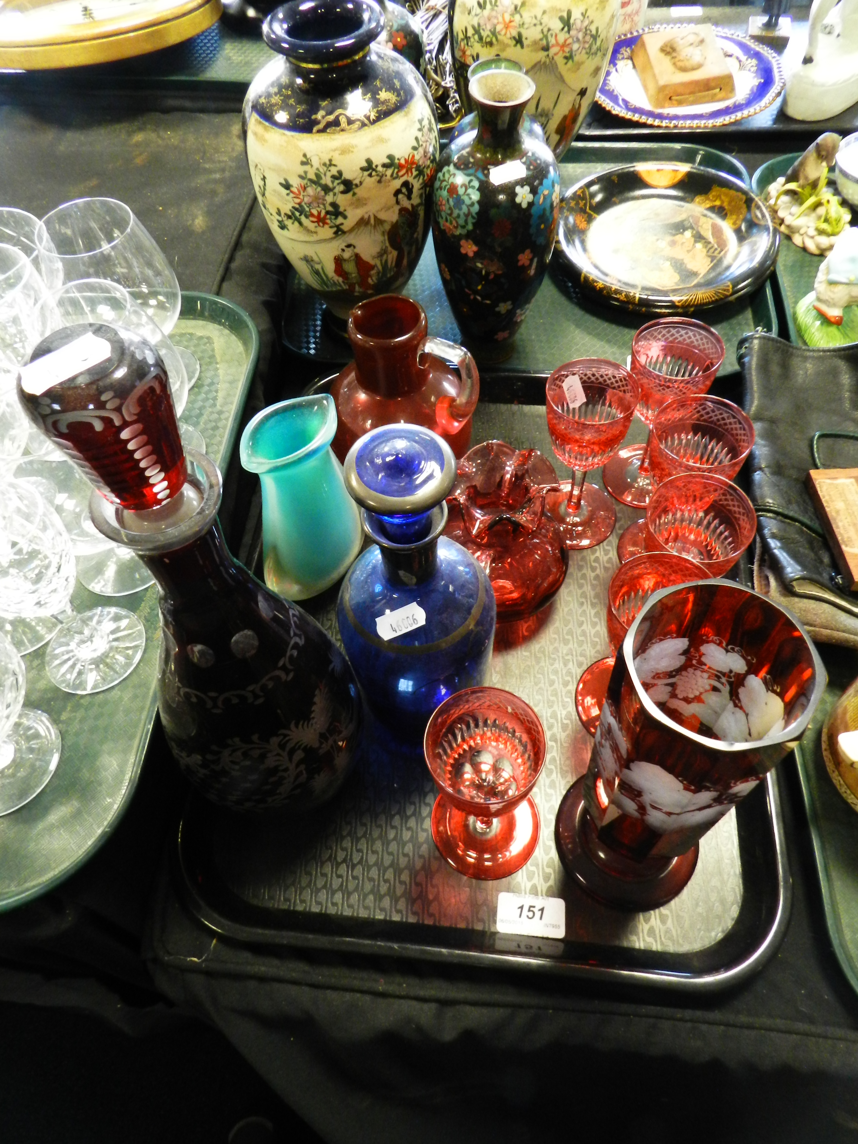 Ruby and other glassware to include a decanter and stopper and vase etched with flowers,