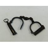 A pair of steel handcuffs inscribed PN1