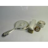 A silver backed hand mirror, together with a silver backed clothes brush,