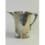 A silver cream jug hallmarked Sheffield