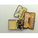 Four 9 carat gold dress studs within a box,