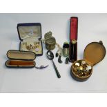 A pair of 9 carat gold cufflinks, together with a 9 carat gold mounted cheroot,