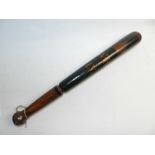 A police truncheon with painted crown above 'W R I V'
