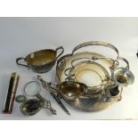 A silver plated two handled sugar bowl with matching cream jug, a silver salt,