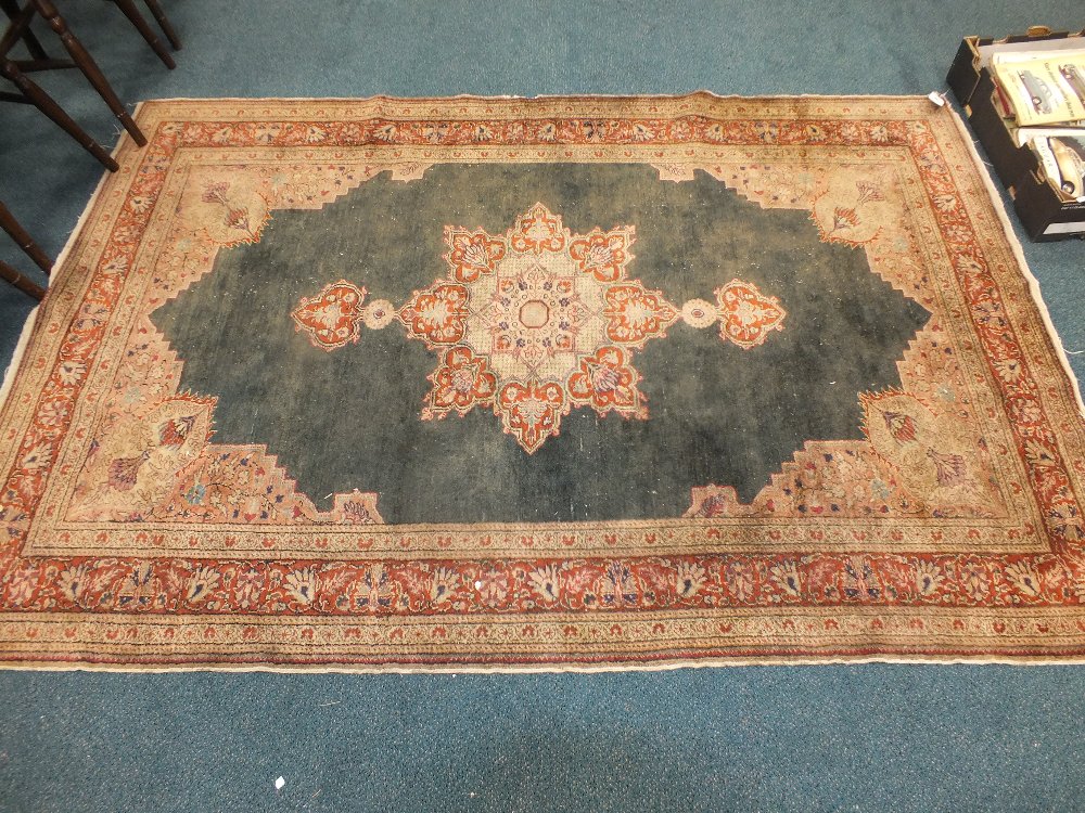 A 20th century cream and red ground triple border rug (at fault)