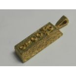 A 9 carat gold 10 gram ingot pendant