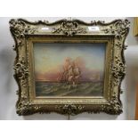 Oil on card of ships at sea in ornate gilt frame