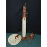 A leather African quiver encasing fifteen arrows,