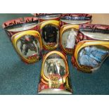 A collection of Lord of the Rings action figures boxed and unopened including 'Helms Deep Legolas',