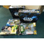 A collection of Star Wars action figures and vehicles including Hasbro and Kenner examples from the