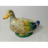 A continental majolica style figural egg or bread crock modelled as a seated goose or duck,