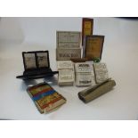 A group of vintage games circa 1910 to include a stereoscope with a collection of printed images,