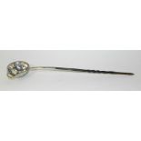 A white metal whale bone handled punch or toddy ladle, the rounded bowl with beaded rim,