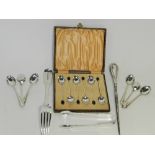 A cased set of six silver coffee spoons with bean terminals,