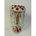 A Bohemian overlay glass lustre, the ruby glass overlaid with white and detailed in gilt,