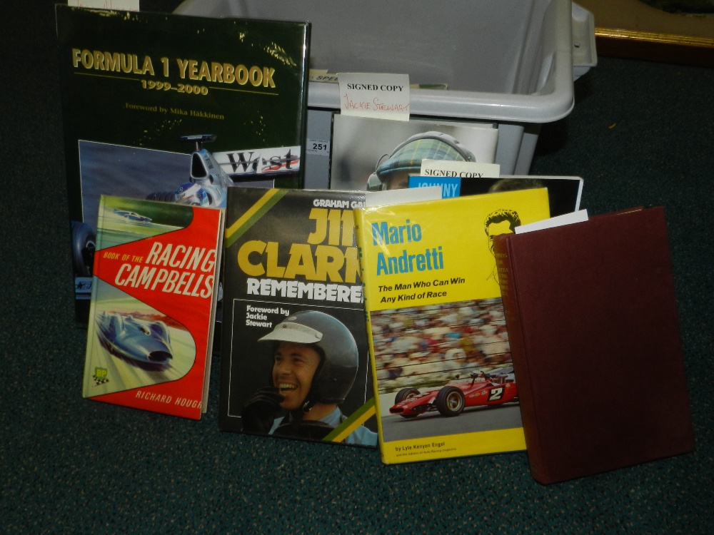 A collection of motor racing interest books and autographs; Robert Edwards 'Stirling Moss',