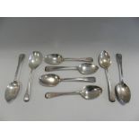 A set of six silver tablespoons, hallmarked London, together with a pair of silver tablespoons,